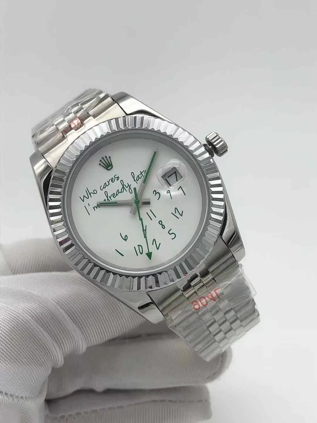 Close up shot of the modern green hands and unique dial text