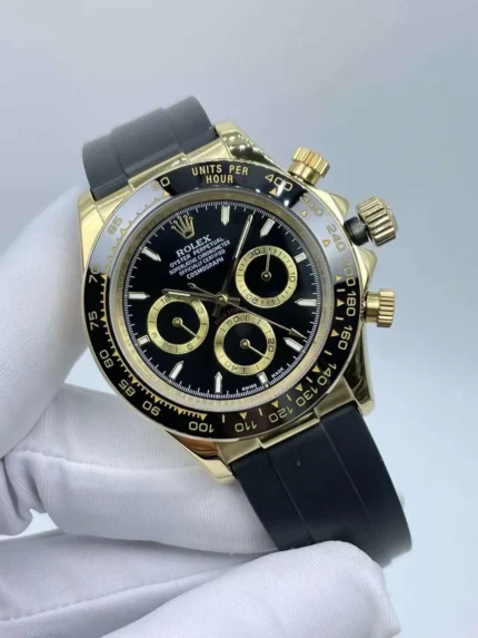 Luxury Rolex Daytona 40mm yellow gold watch with black dial and rubber strap