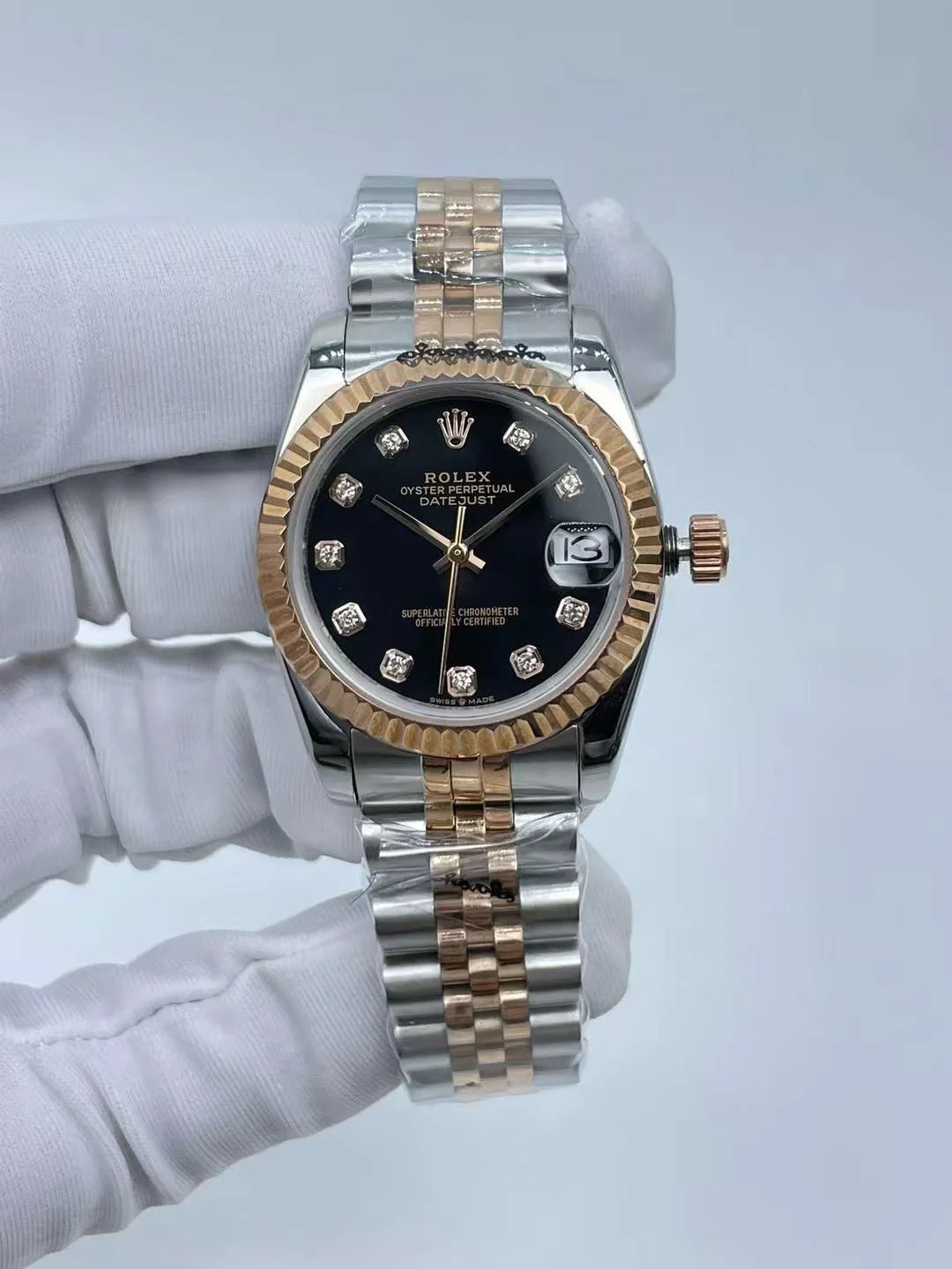 Close up of luxury gold fluted bezel and diamond markers