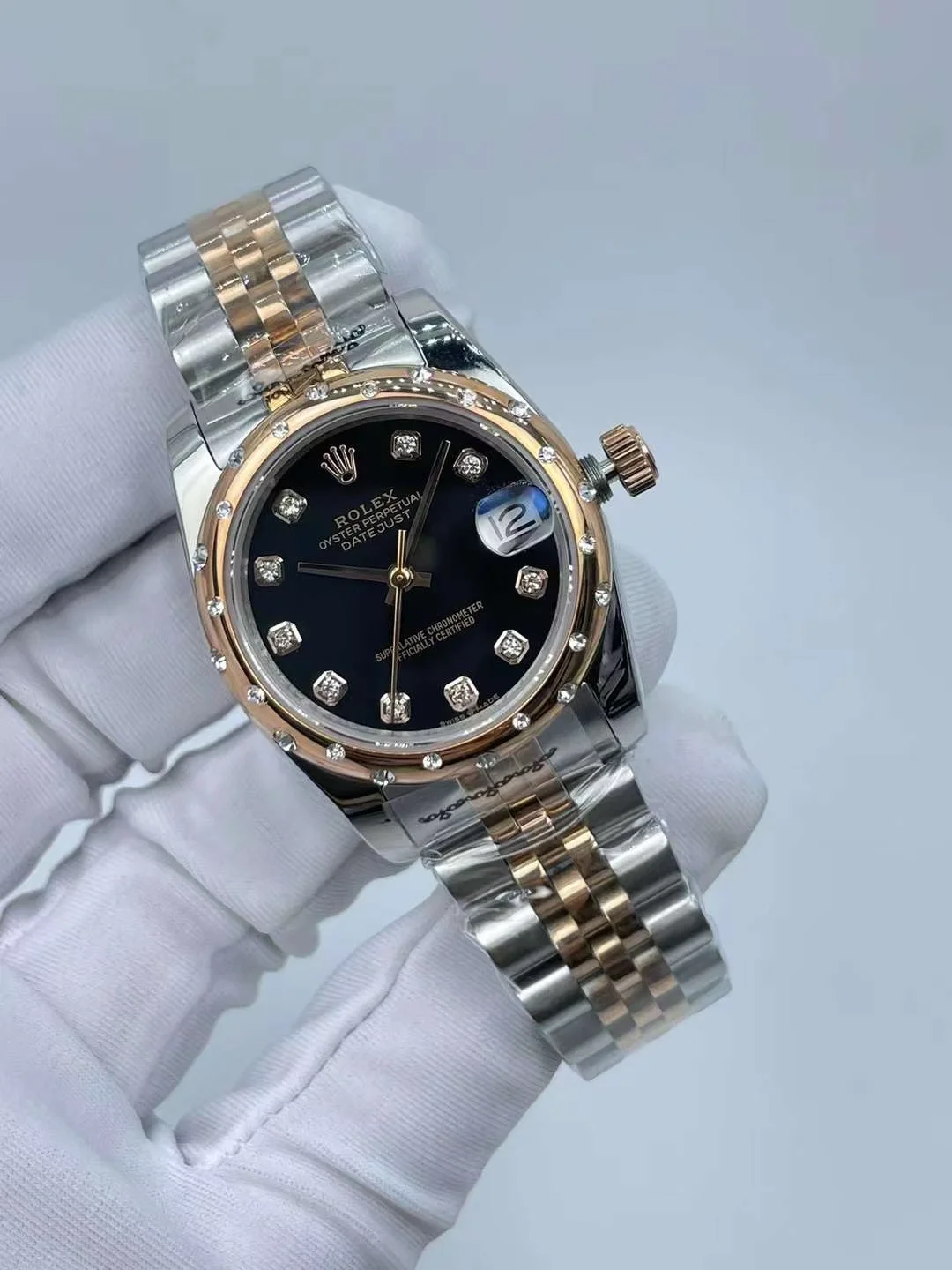 Close up view of luxury watch black dial and diamond markers