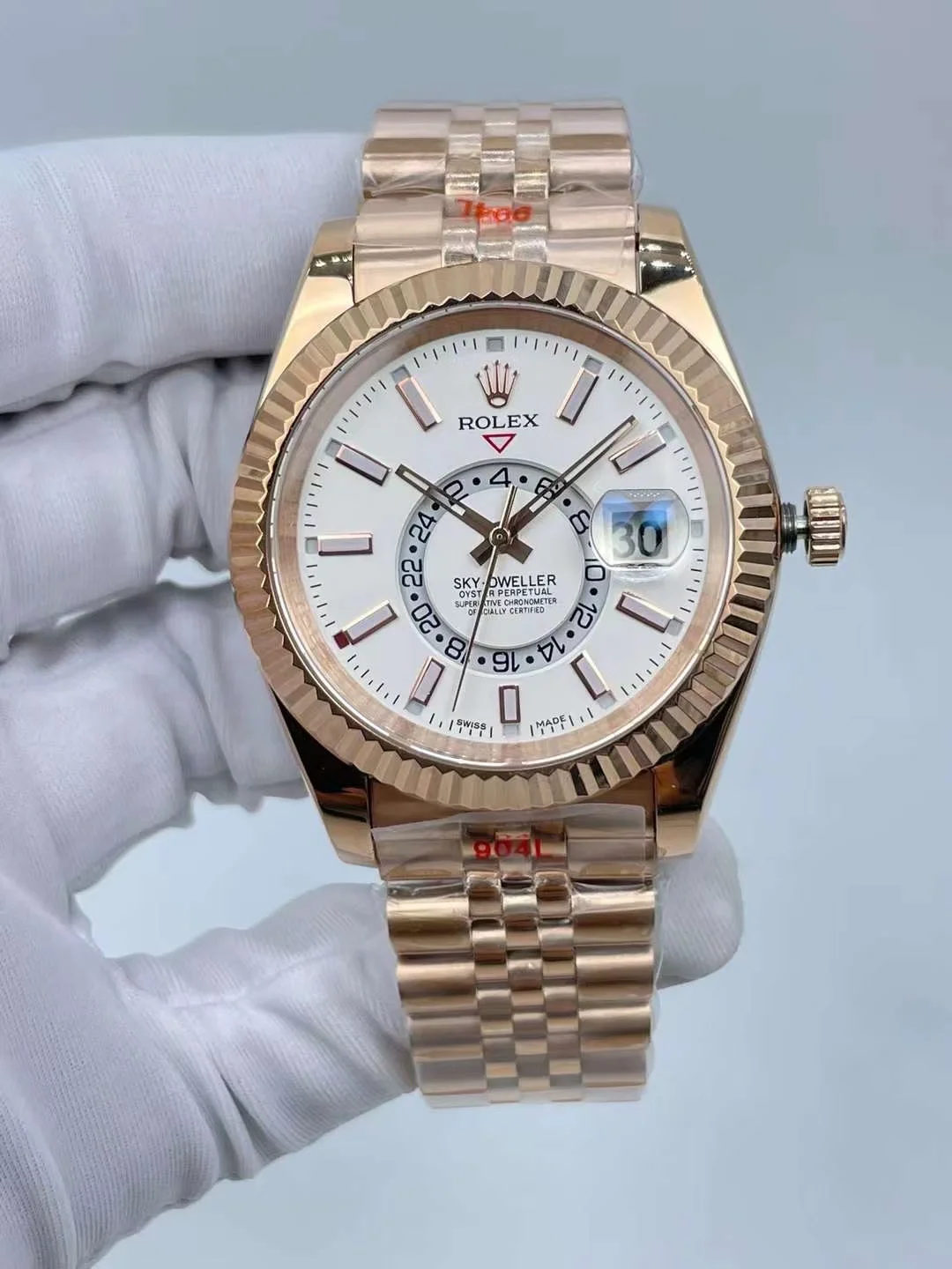 Rolex Sky Dweller 42mm rose gold watch with white dial