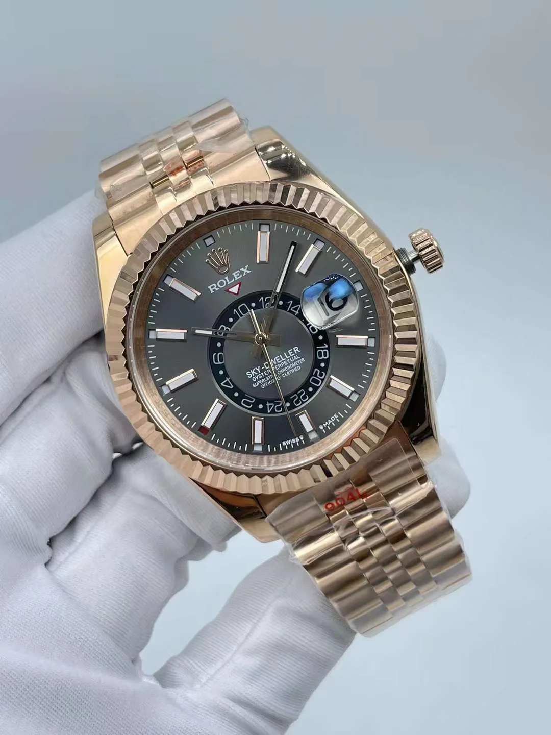 Close up shot of premium rose gold luxury watch with dark grey dial