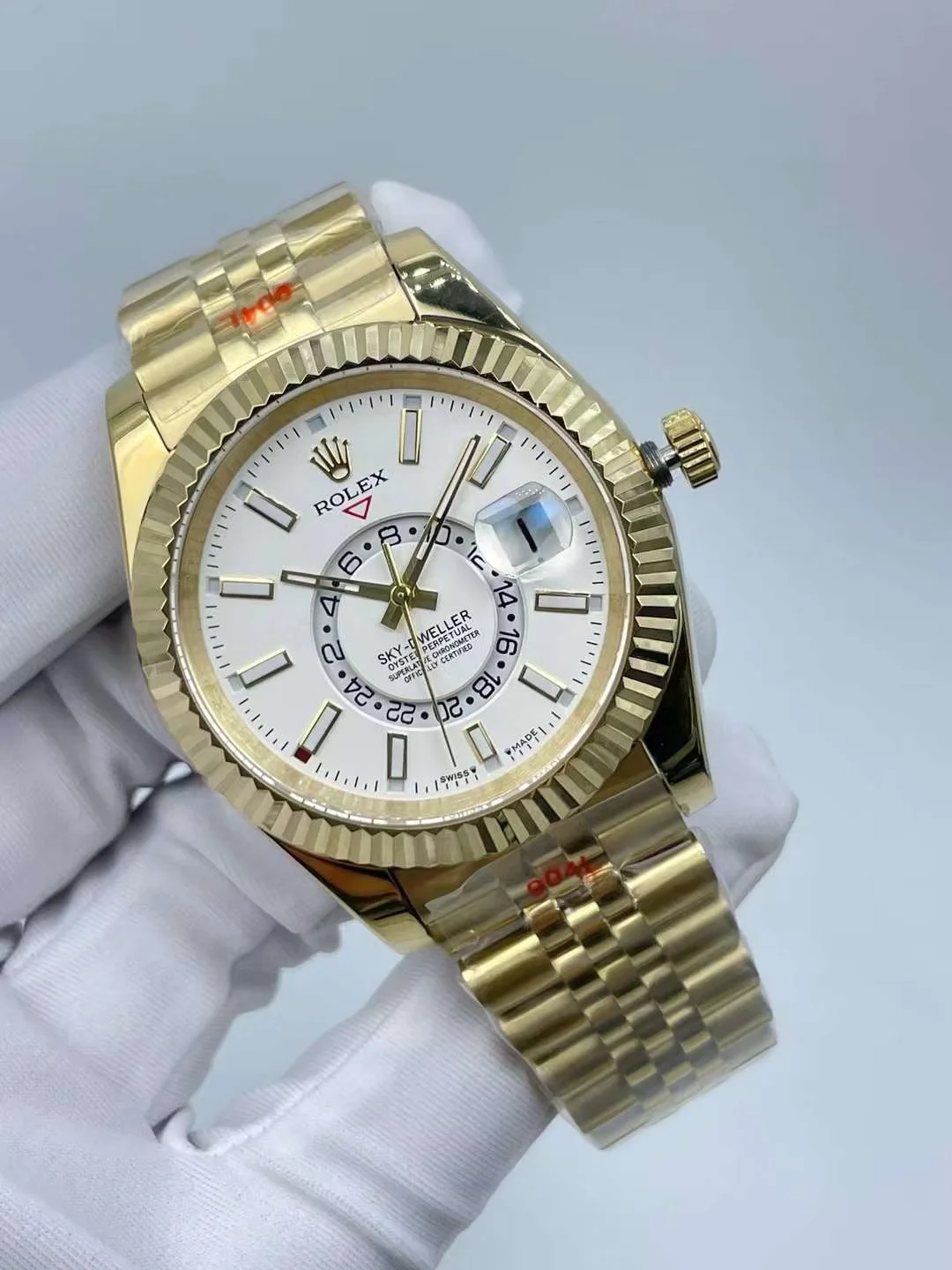 Luxury gold automatic wristwatch showing a sophisticated dual time zone dial